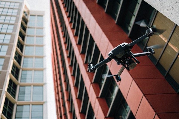 Drone flying near tall buildings urban capture (ID#2)