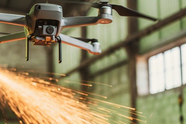 Industrial drone sparks Drone flying with sparks in industrial setting (ID#3)