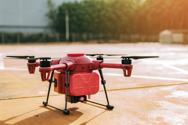 Industrial firefighting drone operating near active fire scene