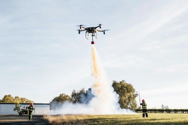 Firefighting drone action Drone releasing fire suppressant mid-air (ID#3)