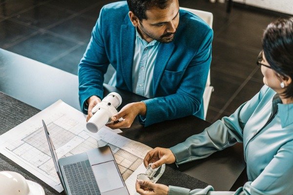 Prototype discussion Two professionals discussing prototype and procurement (ID#3)
