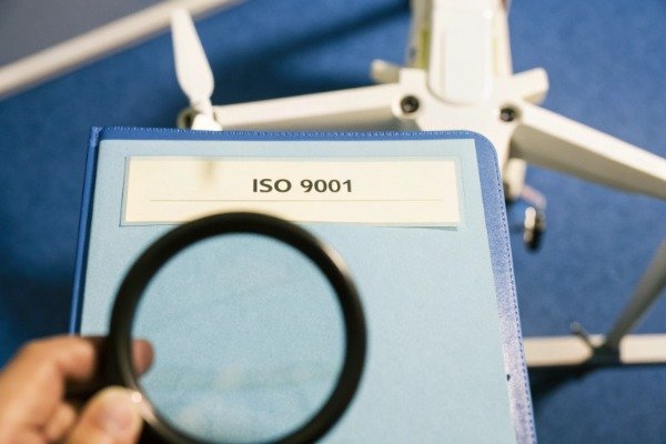 ISO 9001 certificate with drone and magnifying glass (ID#3)