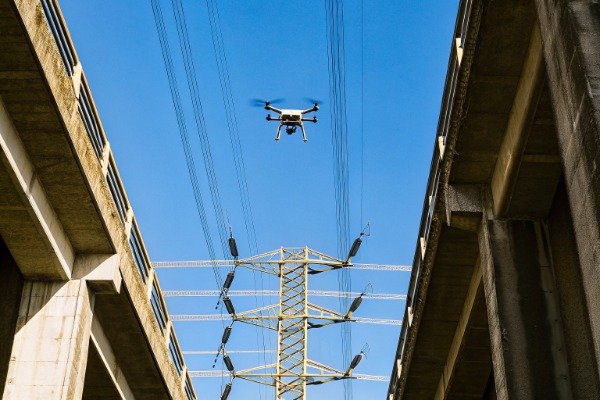 Drone flying cautiously near power lines (ID#4)