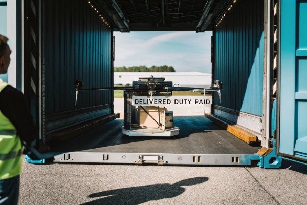 Drone shipment delivery Drone inside shipping container with Delivered Duty Paid sign (ID#5)