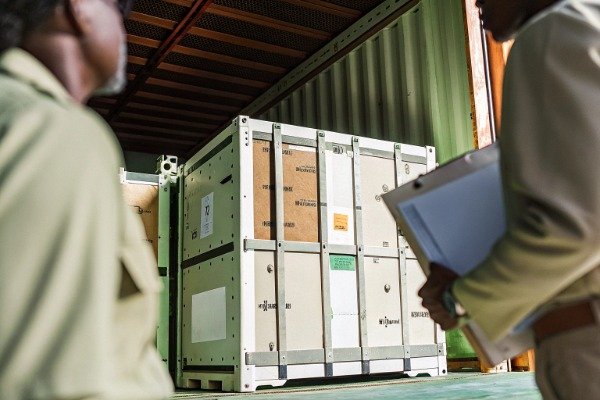 Shipping logistics with large crate and clipboard (ID#5)