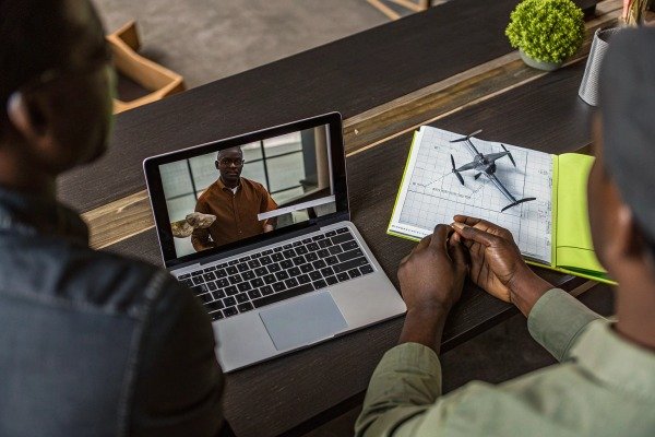 People watching drone presentation on laptop (ID#4)