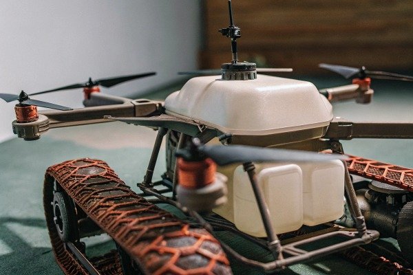 Close-up of an agricultural drone with tank and track system (ID#5)