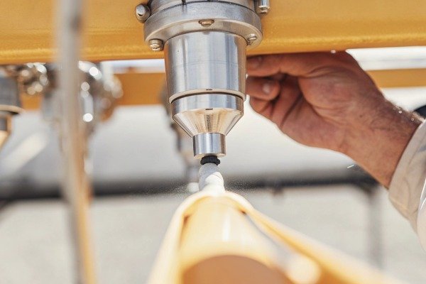 Adjusting drone spray nozzle Close-up of a hand adjusting a drone nozzle (ID#2)