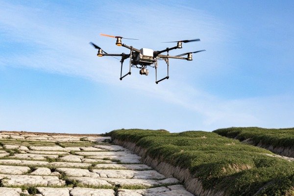 Drone flying over field Agricultural drone flying over a field with crops (ID#3)