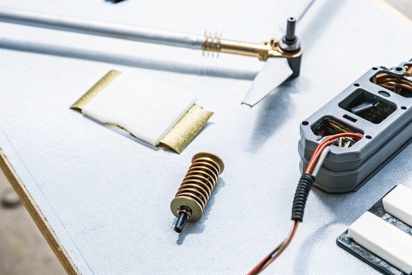 Drone parts and tools on workbench (ID#4)