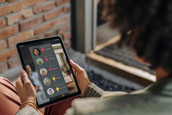 Person using tablet for video call (ID#4)