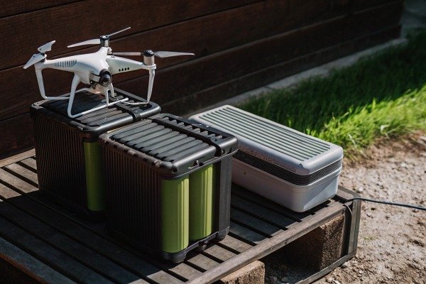 Drone on battery packs outdoors on wooden bench (ID#3)