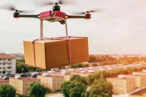 Drone delivering package over cityscape (ID#5)