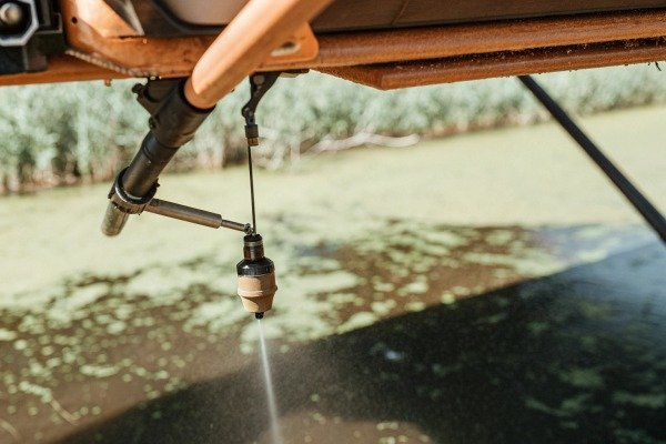Close-up of drone spraying water over pond (ID#5)