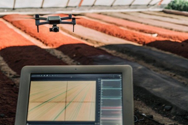 Drone flying over soil with tablet monitoring (ID#5)