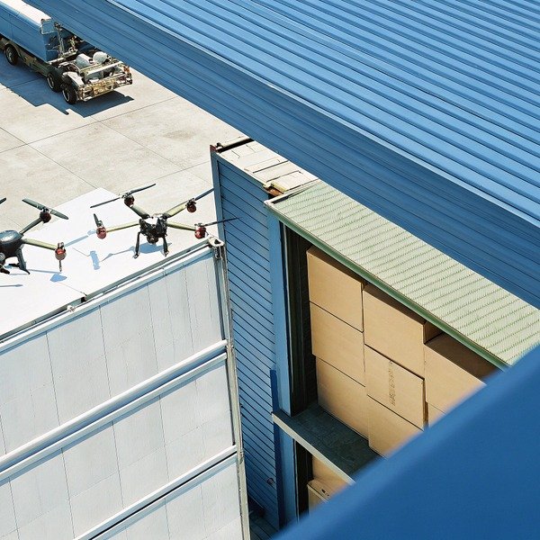 Drones on rooftop near warehouse loading dock (ID#1)