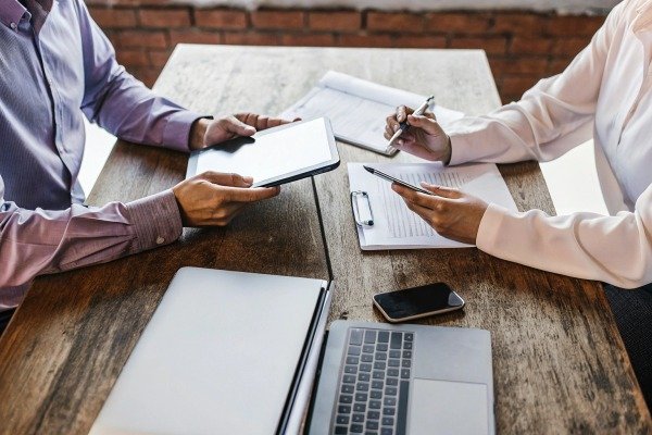 Business meeting with digital devices on table (ID#2)