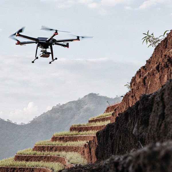 Drone flying over terraced hillside landscape (ID#1)