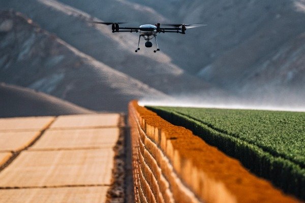 Drone flying over agricultural fields and hills (ID#5)