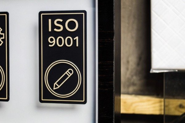 ISO 9001 certification sign on wall (ID#4)
