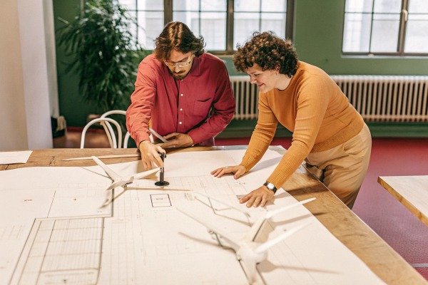 Wind turbine models Two people reviewing wind turbine models (ID#4)