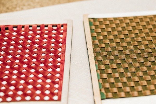 Red and green woven materials on table (ID#3)
