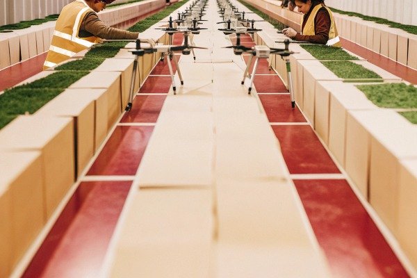 Workers inspecting crops with drones indoors (ID#5)