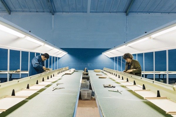 Workers inspecting products on assembly line (ID#2)