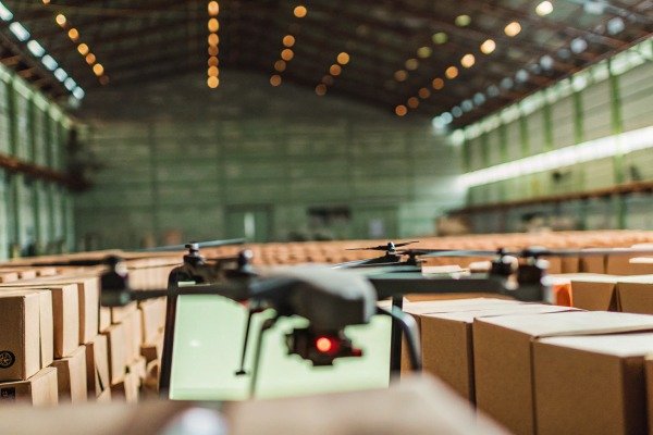 Drone flying over warehouse boxes indoors (ID#4)