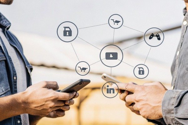 People using smartphones with social media icons overlay (ID#5)