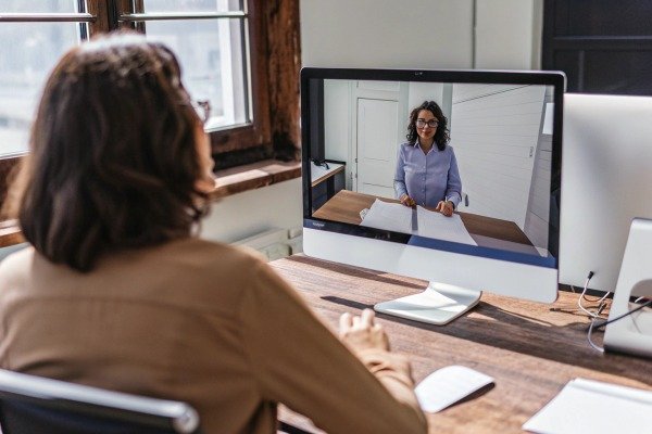 Woman video conferencing on computer (ID#3)