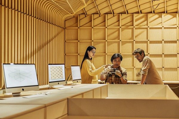 Team discussing drone in modern office space (ID#4)