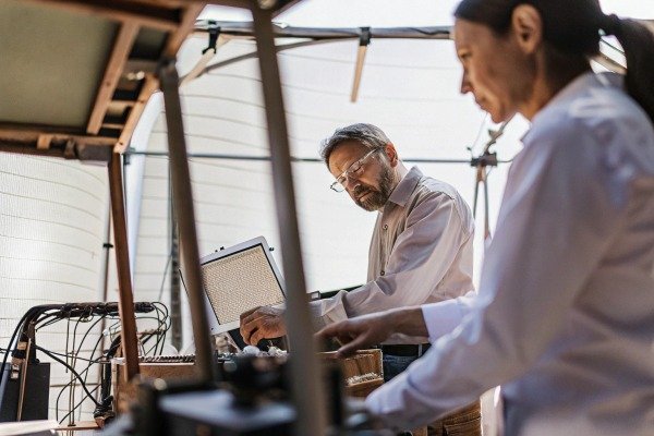 Scientists working on drone technology indoors (ID#3)