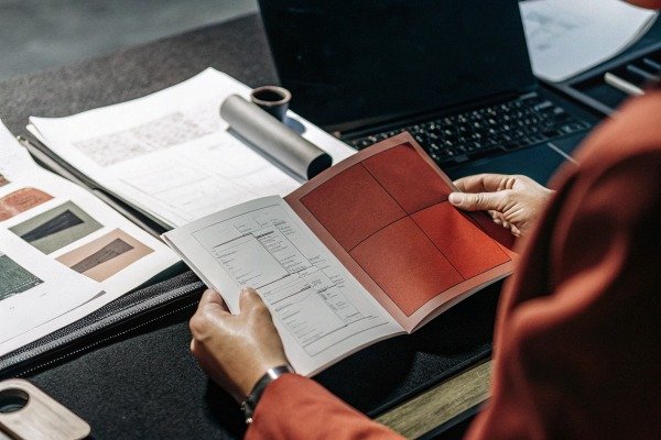 Person reviewing agricultural data booklet (ID#5)