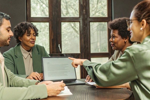 Business meeting with laptop and discussion (ID#4)