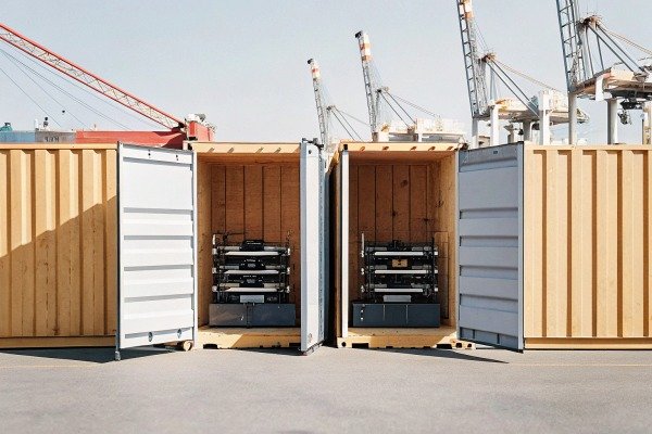 Open shipping containers with equipment inside (ID#4)
