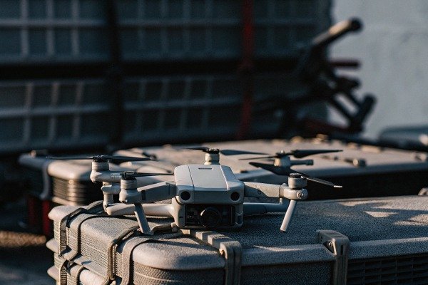 Drone resting on case in outdoor setting (ID#5)