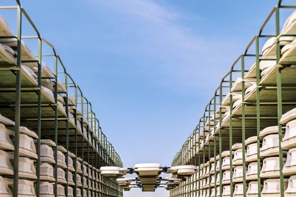 Rows of industrial drone components stored on outdoor metal shelving units (ID#3)