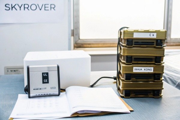 Stacked electronic equipment with UL and CE certification labels on a desk (ID#5)