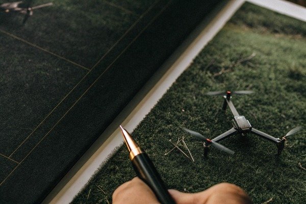 Remote controller with a smartphone screen displaying drone flight telemetry (ID#3)