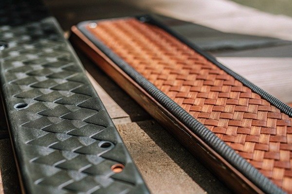 Drone pilot operating a remote controller with a smartphone screen attached (ID#4)