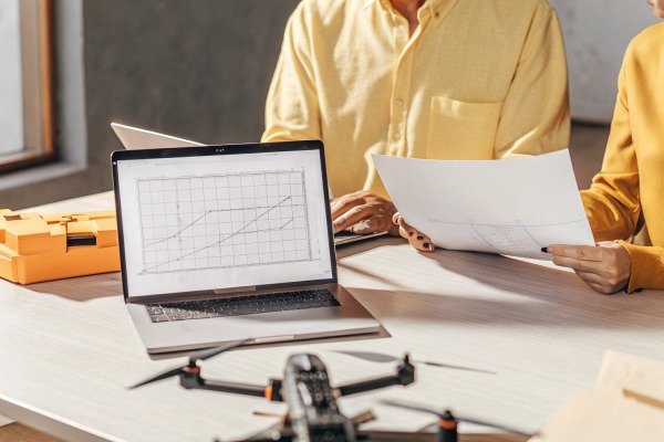 Aerial view of a city skyline captured by a drone at sunset (ID#5)
