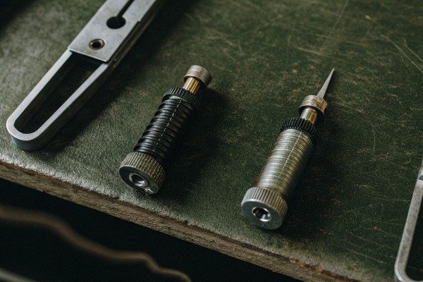 Modern quadcopter drone landing on a dedicated landing pad outdoors (ID#4)