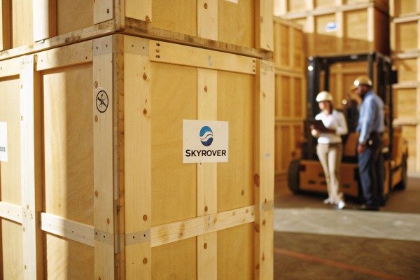 Drone landing on a specialized landing pad in a grassy field (ID#5)