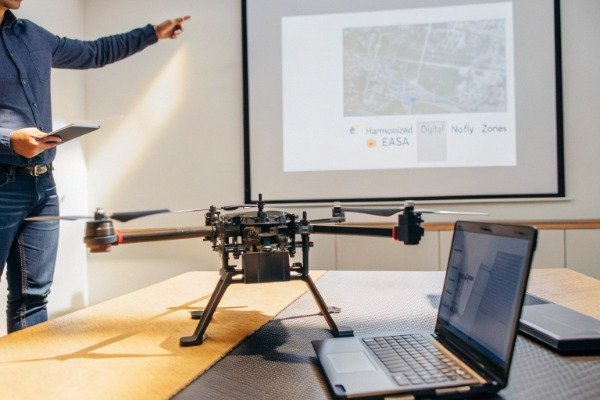 Engineer checking geofencing map for EASA no-fly zones (ID#1)